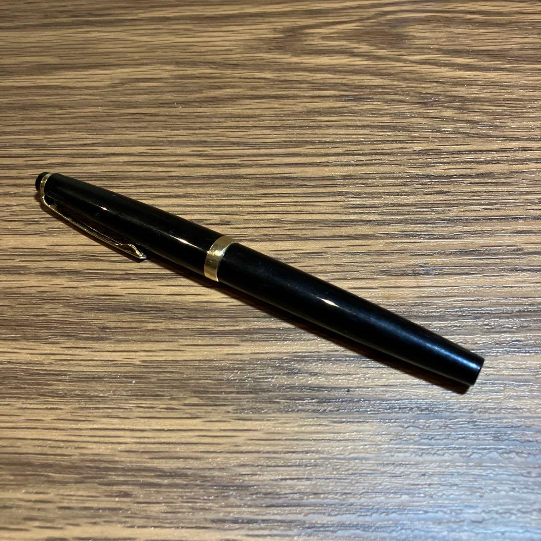 Pilot Black Cap Fountain Pen with black body and gold-plated nib and tip shown on white background