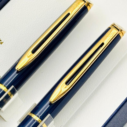 Waterman pen set featuring navy and gold ballpoint pen and mechanical pencil with original French case