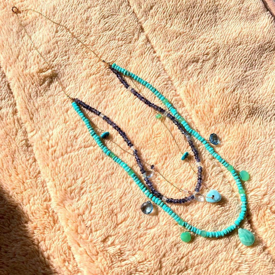 agete 10K gold necklace with three strands featuring blue turquoise and tanzanite stones