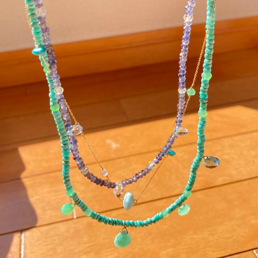 agete 10K gold necklace with three strands featuring blue turquoise and tanzanite stones