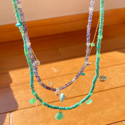 agete 10K gold necklace with three strands featuring blue turquoise and tanzanite stones