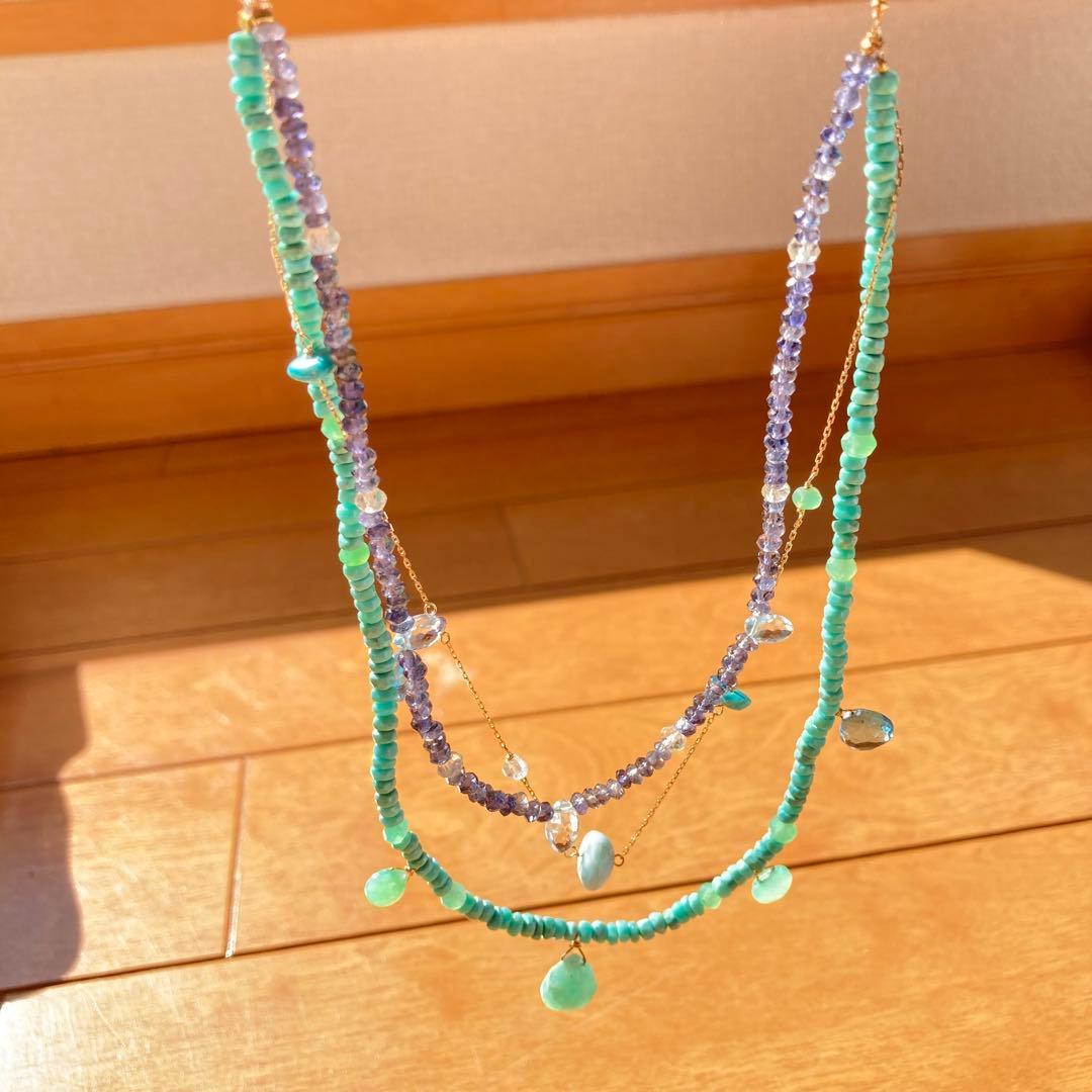 agete 10K gold necklace with three strands featuring blue turquoise and tanzanite stones