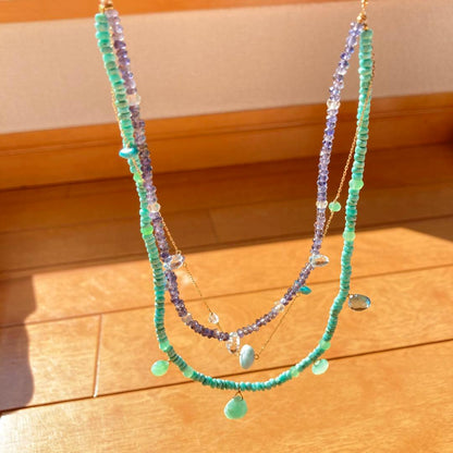 agete 10K gold necklace with three strands featuring blue turquoise and tanzanite stones