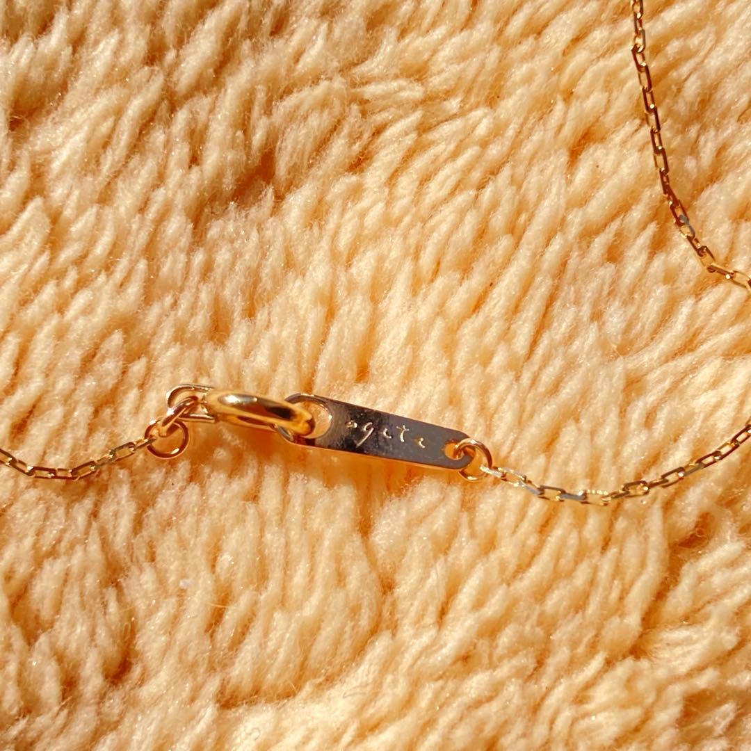 agete 10K gold necklace with three strands featuring blue turquoise and tanzanite stones