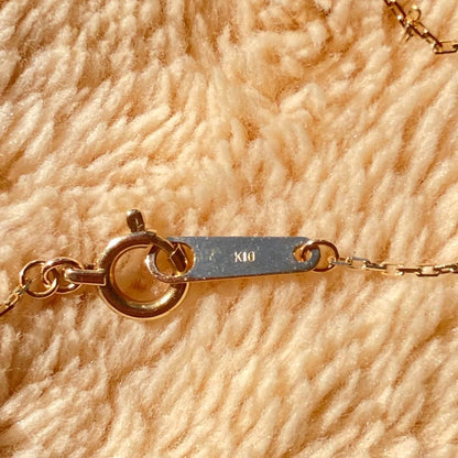 agete 10K gold necklace with three strands featuring blue turquoise and tanzanite stones
