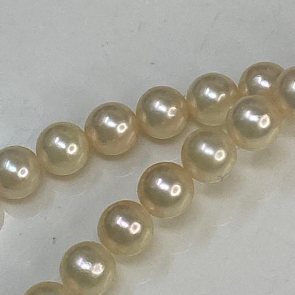 Close-up of Akoya Pearl Necklace featuring 7mm pearls and a 42cm length on a white background