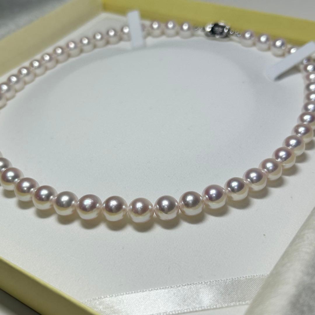 Akoya pearl necklace with 8-8.5 mm pearls and silver clasp on a white background