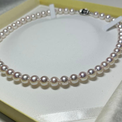 Akoya pearl necklace with 8-8.5 mm pearls and silver clasp on a white background