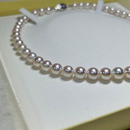Akoya pearl necklace with 8-8.5 mm pearls and silver clasp on a white background