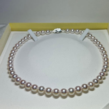Akoya pearl necklace with 8-8.5 mm pearls and silver clasp on a white background