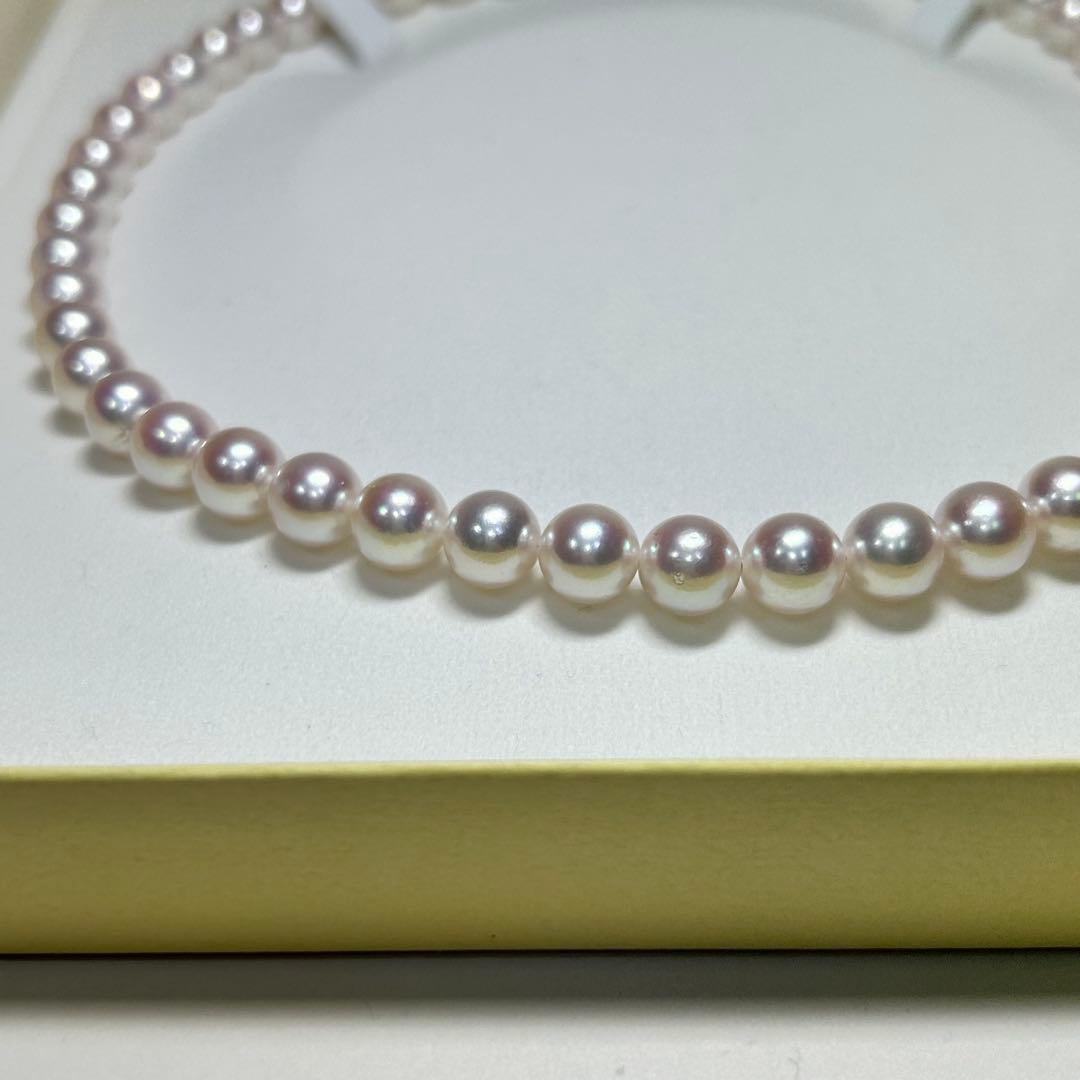 Akoya pearl necklace with 8-8.5 mm pearls and silver clasp on a white background