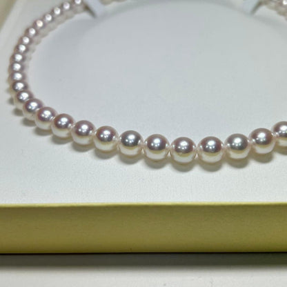 Akoya pearl necklace with 8-8.5 mm pearls and silver clasp on a white background