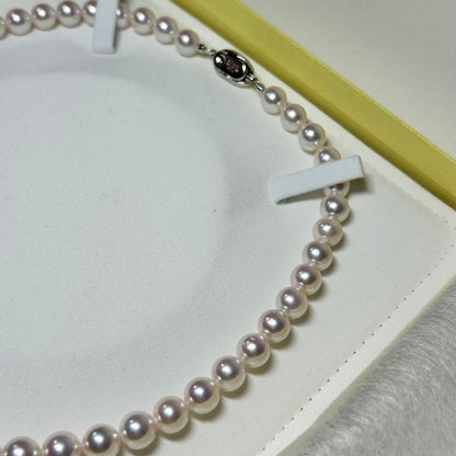 Akoya pearl necklace with 8-8.5 mm pearls and silver clasp on a white background