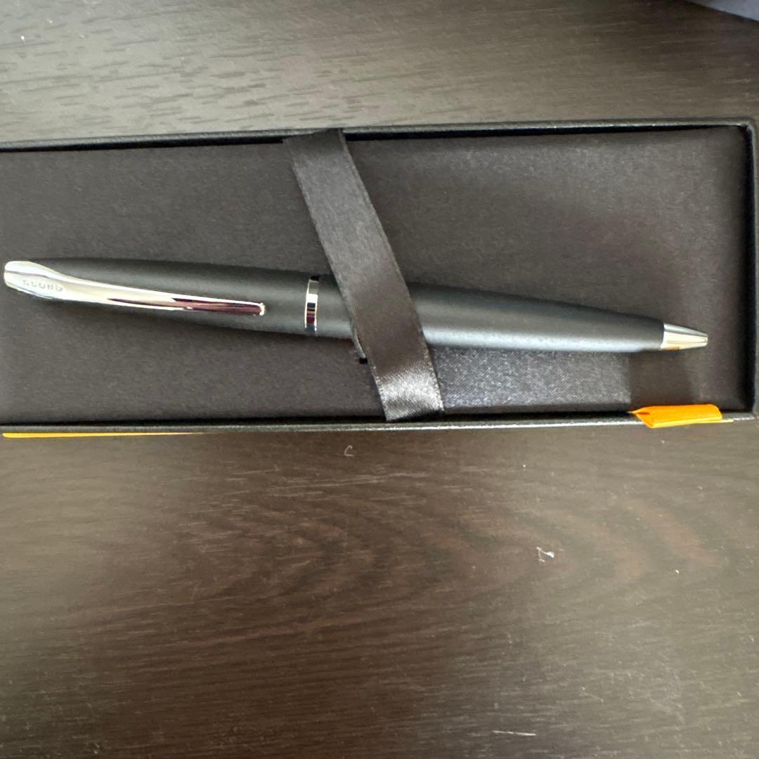 New CROSS black ballpoint pen displayed with its original box on a white background