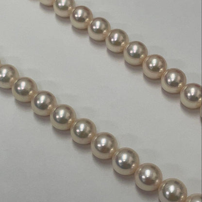 Akoya pearl necklace featuring 7.06mm pearls, six rubies, and a K14WG clasp on a 43cm chain