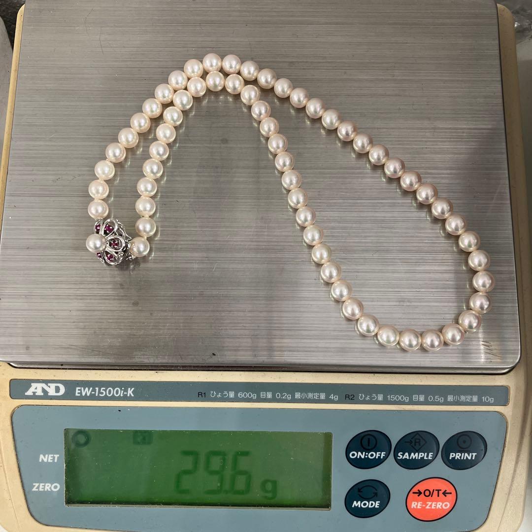Akoya pearl necklace featuring 7.06mm pearls, six rubies, and a K14WG clasp on a 43cm chain