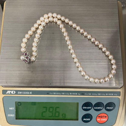 Akoya pearl necklace featuring 7.06mm pearls, six rubies, and a K14WG clasp on a 43cm chain