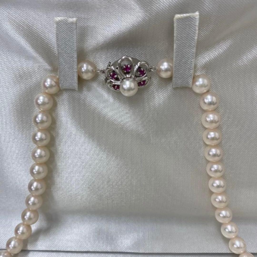 Akoya pearl necklace featuring 7.06mm pearls, six rubies, and a K14WG clasp on a 43cm chain