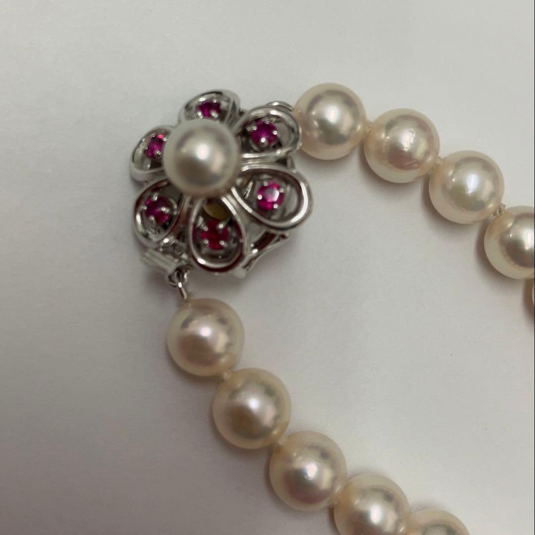 Akoya pearl necklace featuring 7.06mm pearls, six rubies, and a K14WG clasp on a 43cm chain