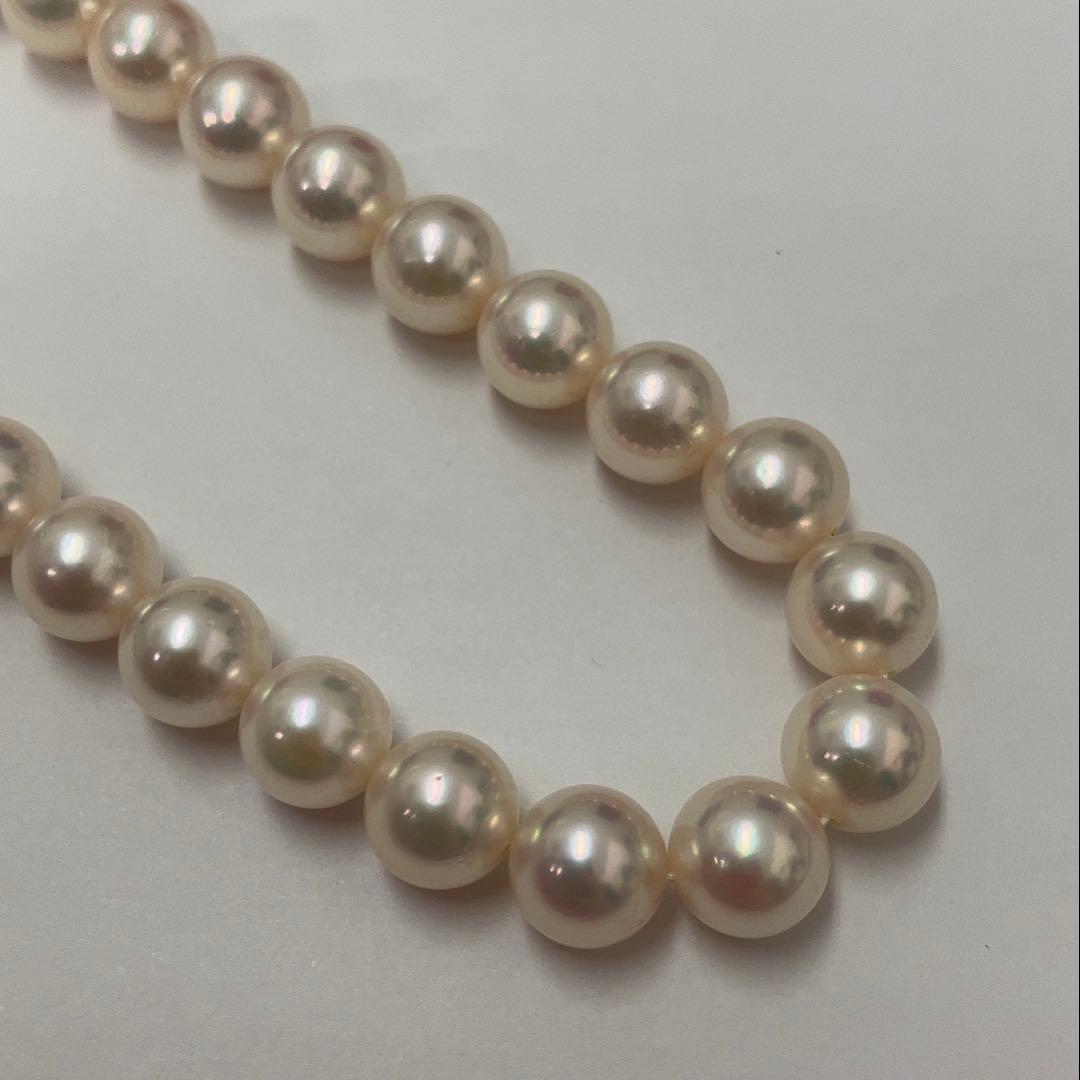 Akoya pearl necklace featuring 7.06mm pearls, six rubies, and a K14WG clasp on a 43cm chain