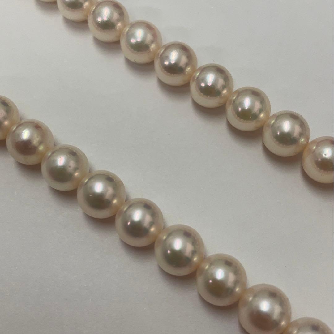 Akoya pearl necklace featuring 7.06mm pearls, six rubies, and a K14WG clasp on a 43cm chain