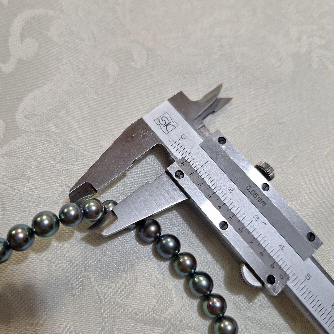 Akoya 6mm pearl Tahitian color necklace 37cm with matching titanium earrings displayed on white background