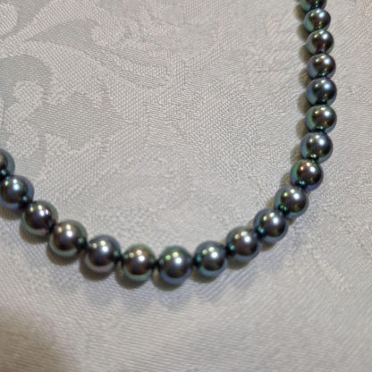Akoya 6mm pearl Tahitian color necklace 37cm with matching titanium earrings displayed on white background