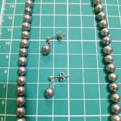 Akoya 6mm pearl Tahitian color necklace 37cm with matching titanium earrings displayed on white background