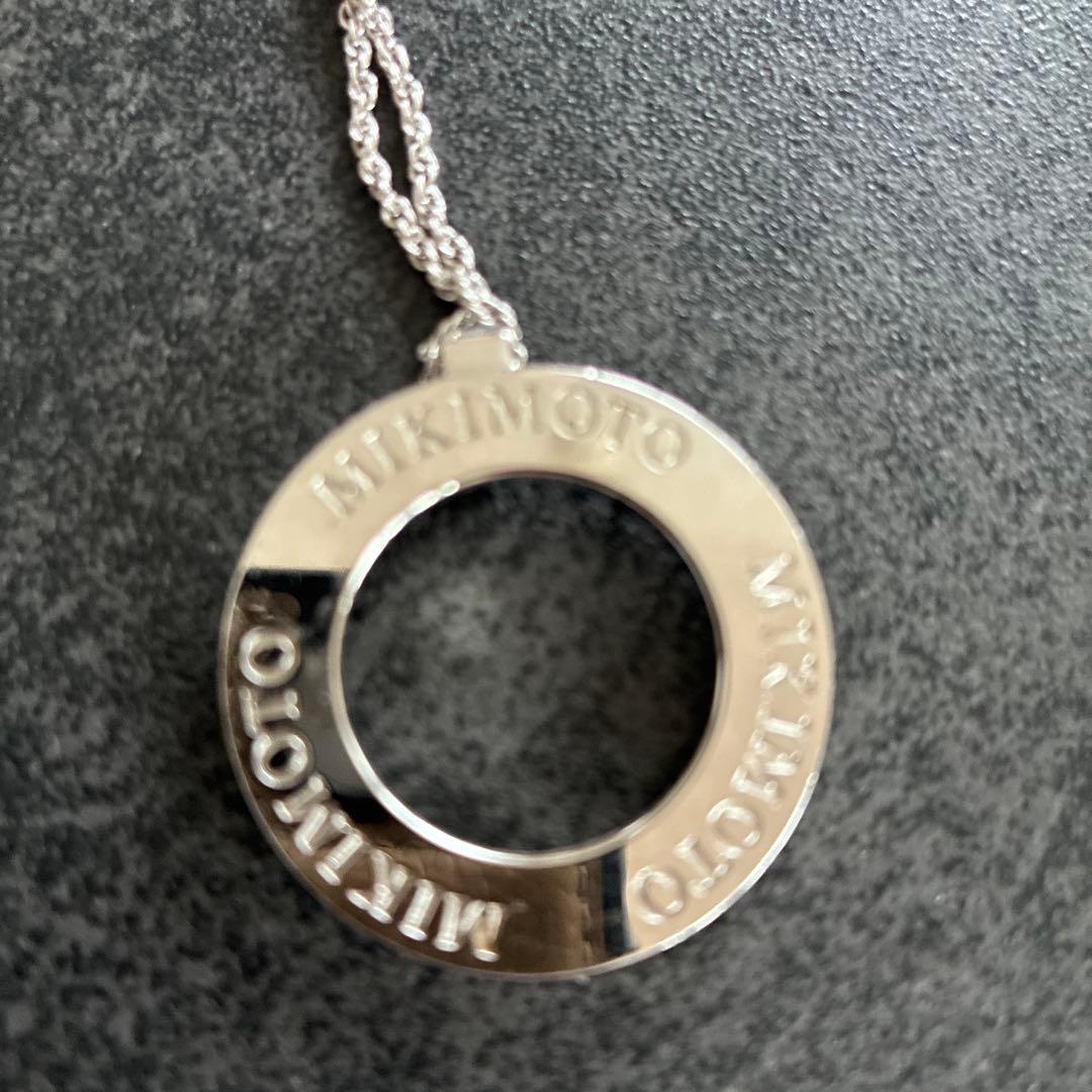 MIKIMOTO silver Circle Logo Necklace with 3 cm diameter pendant on a delicate chain
