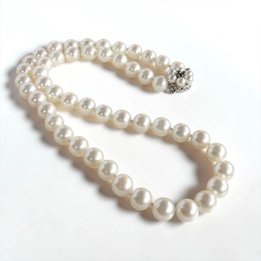 Takasaki K14 Akoya pearl necklace featuring 8mm pearls and sapphire flower pendant
