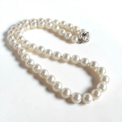 Takasaki K14 Akoya pearl necklace featuring 8mm pearls and sapphire flower pendant
