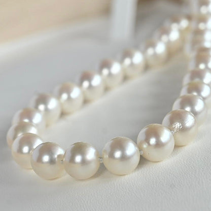 Takasaki K14 Akoya pearl necklace featuring 8mm pearls and sapphire flower pendant