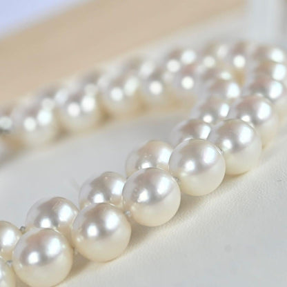 Takasaki K14 Akoya pearl necklace featuring 8mm pearls and sapphire flower pendant