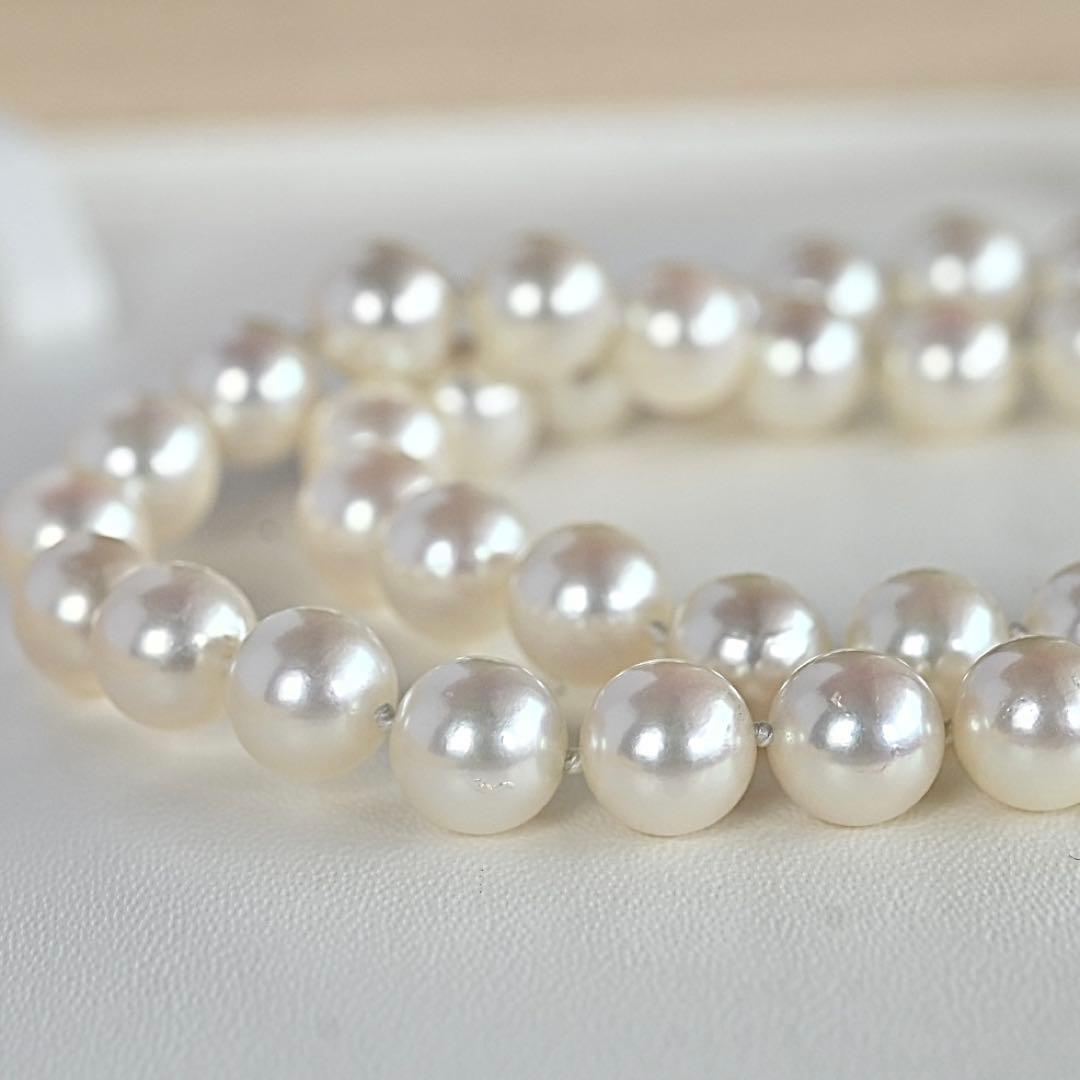 Takasaki K14 Akoya pearl necklace featuring 8mm pearls and sapphire flower pendant