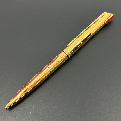 Vintage Waterman gold ballpoint pen in old condition with signs of wear and potential stains