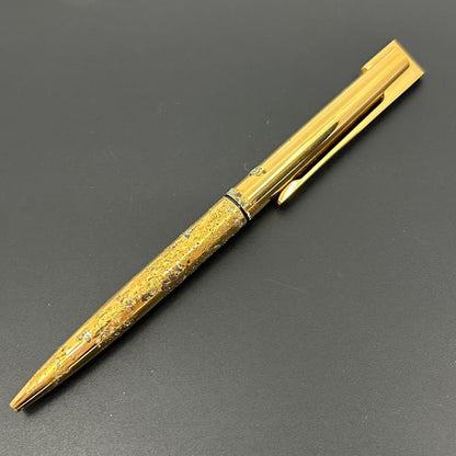 Vintage Waterman gold ballpoint pen in old condition with signs of wear and potential stains