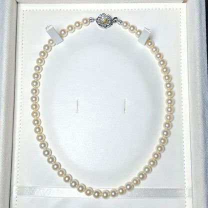 Akoya pearl necklace featuring 6.5 to 7.0 mm round white pearls set on a 41.5 cm silver chain