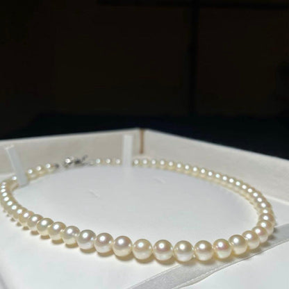 Akoya pearl necklace featuring 6.5 to 7.0 mm round white pearls set on a 41.5 cm silver chain