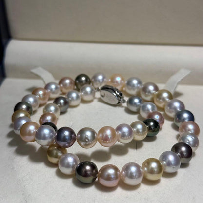White and black pearl necklace featuring 11mm multicolor pearls with silver clasp on 44cm chain