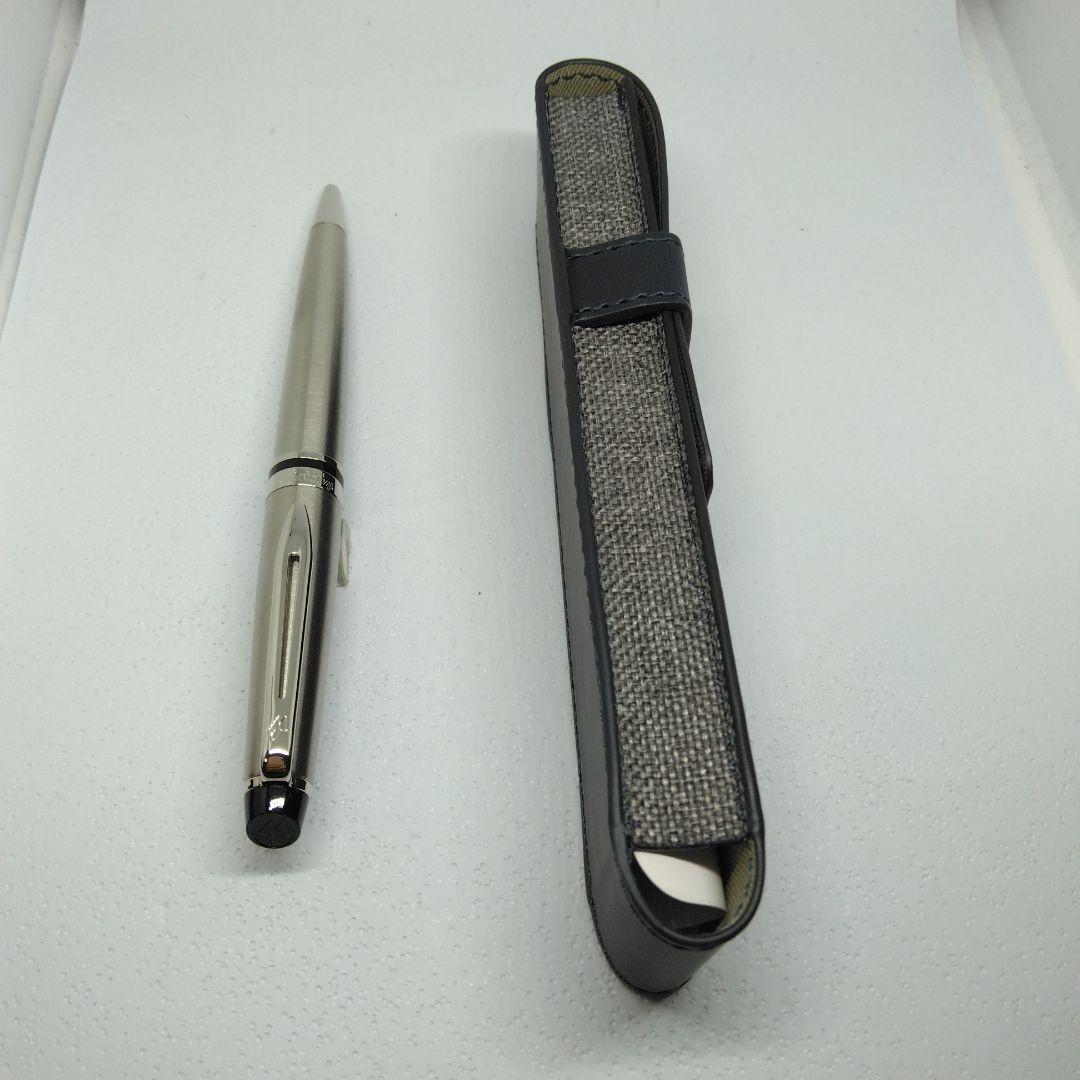 Waterman Expert silver ballpoint pen with black leather case on a white background