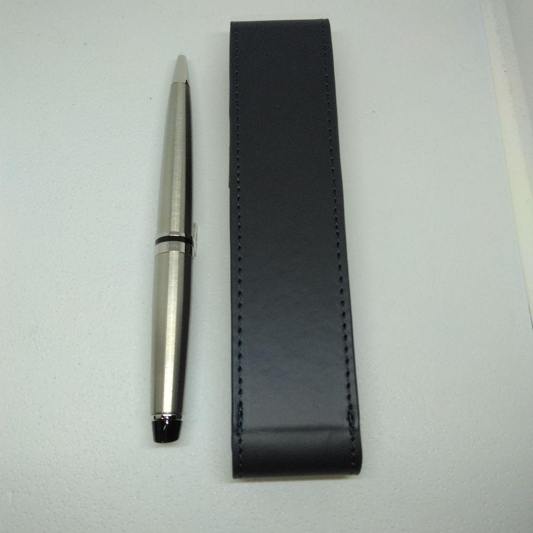 Waterman Expert silver ballpoint pen with black leather case on a white background