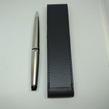 Waterman Expert silver ballpoint pen with black leather case on a white background