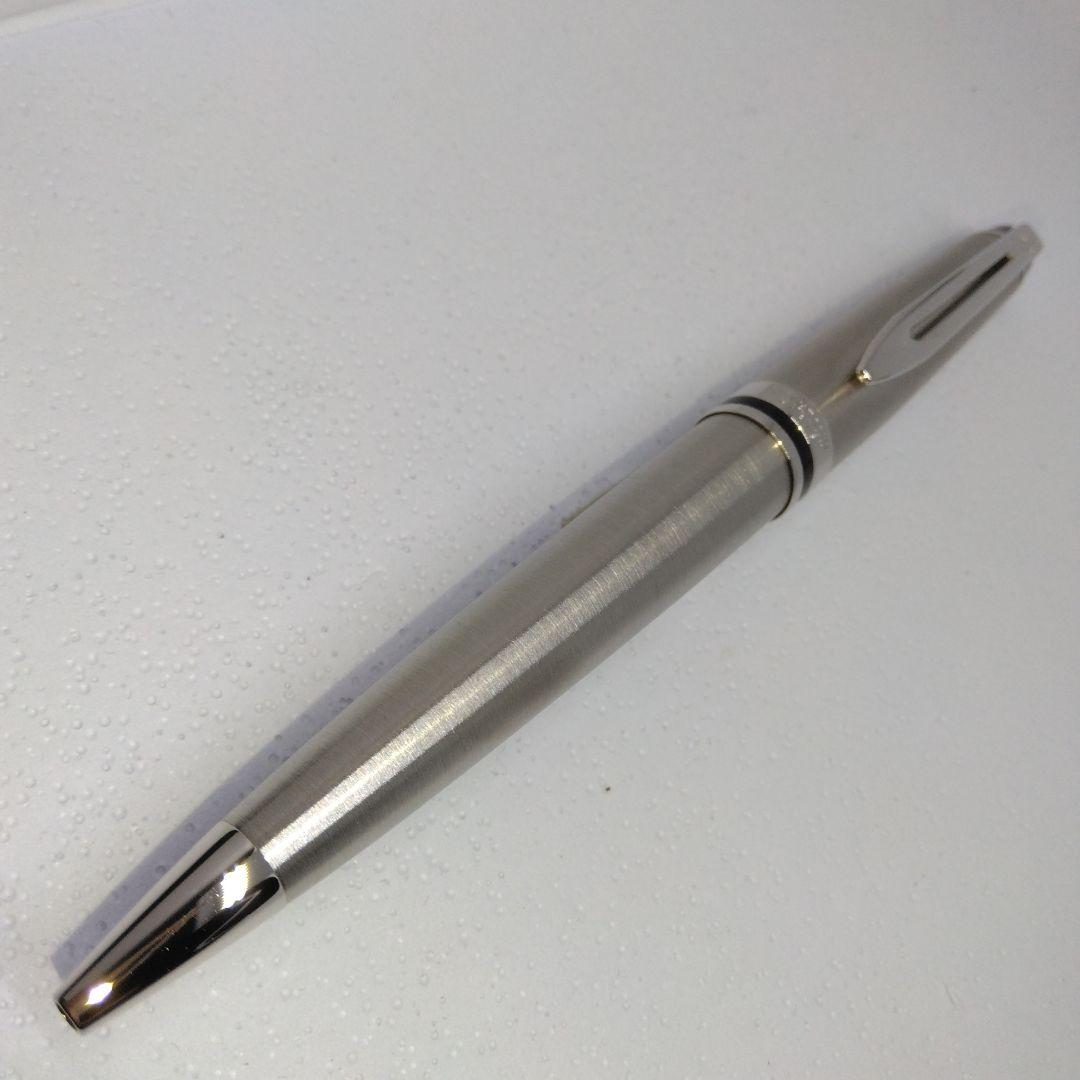 Waterman Expert silver ballpoint pen with black leather case on a white background