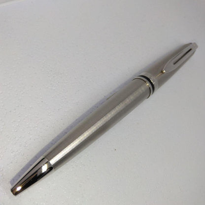 Waterman Expert silver ballpoint pen with black leather case on a white background