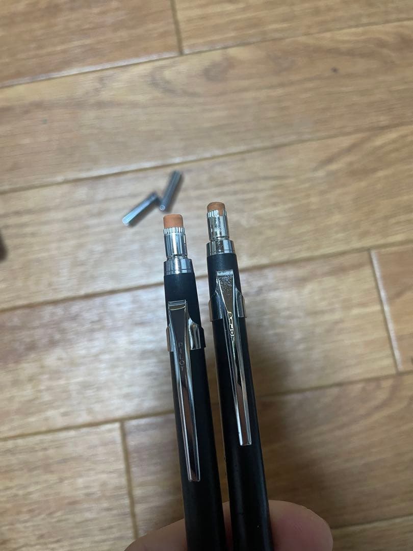 Two used Pilot Hi-Meka Holder Initial Model pieces showing some scratches and stains