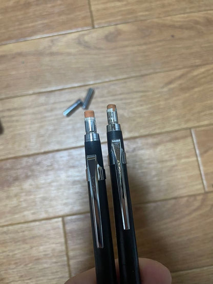 Two used Pilot Hi-Meka Holder Initial Model pieces showing some scratches and stains