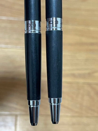 Two used Pilot Hi-Meka Holder Initial Model pieces showing some scratches and stains