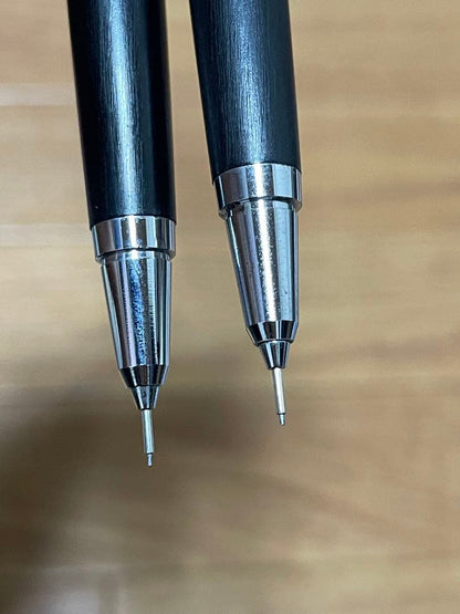 Two used Pilot Hi-Meka Holder Initial Model pieces showing some scratches and stains