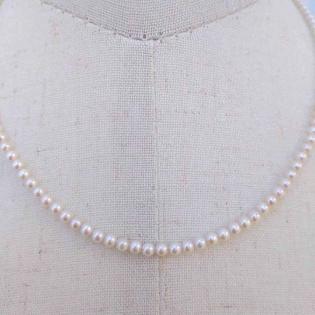 Close-up of Baby Akoya Pearl Necklace with 3-3.5mm pearls, 43cm length, displayed on a white background