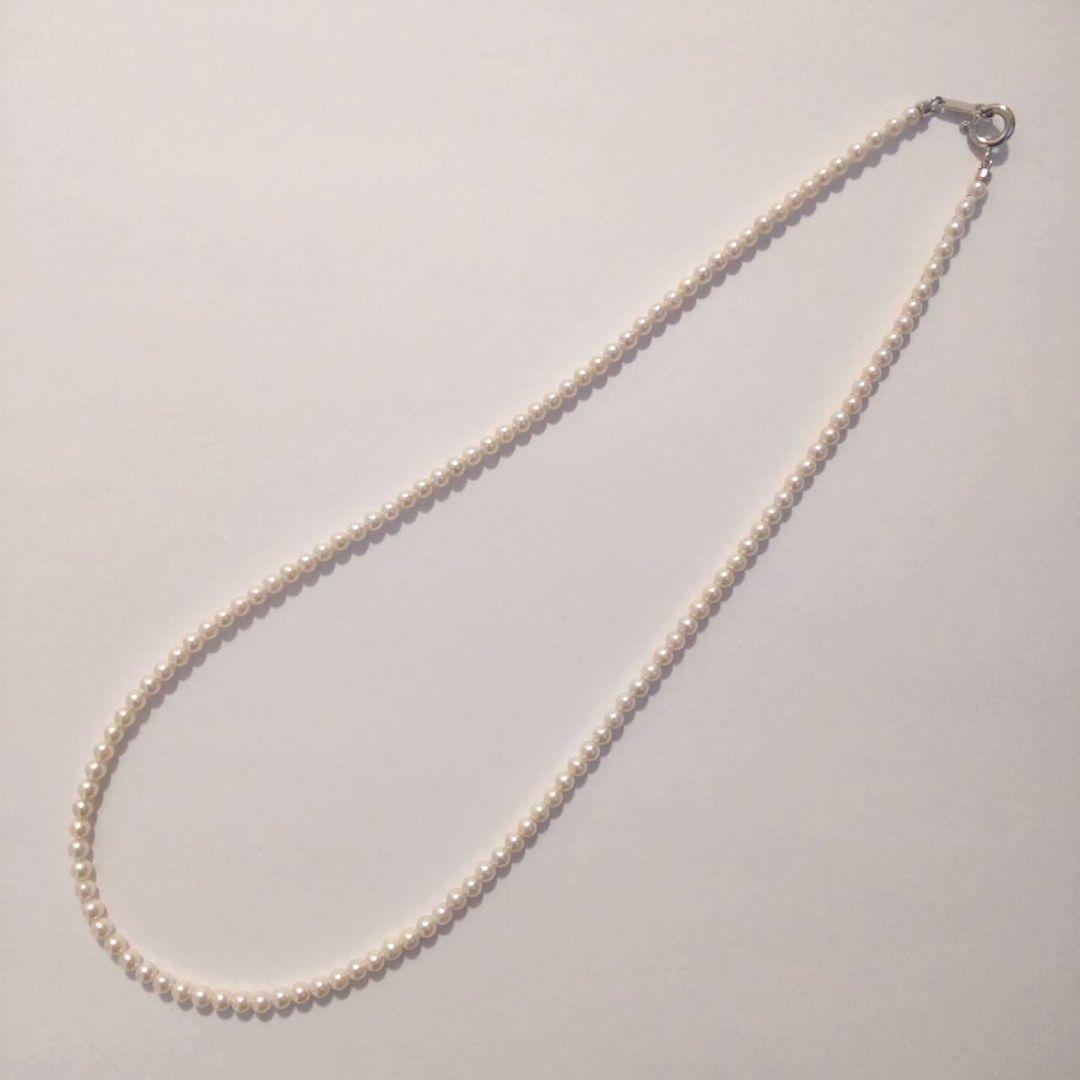 Close-up of Baby Akoya Pearl Necklace with 3-3.5mm pearls, 43cm length, displayed on a white background